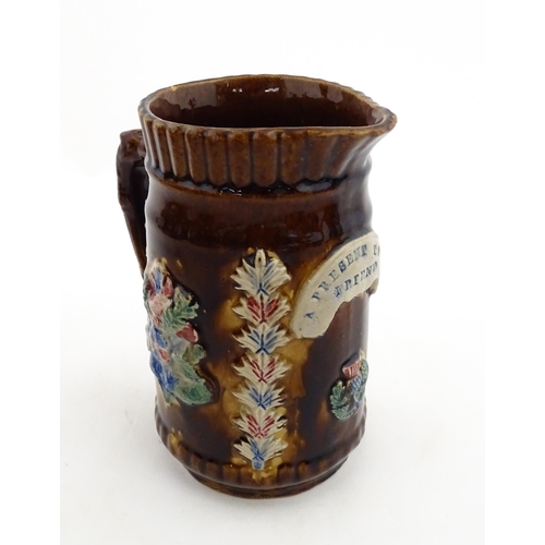 155 - Four items of 19thC Measham bargeware to include a jug floral and foliate detail and the motto A Pre... 