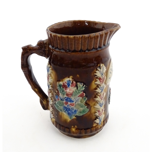 155 - Four items of 19thC Measham bargeware to include a jug floral and foliate detail and the motto A Pre... 