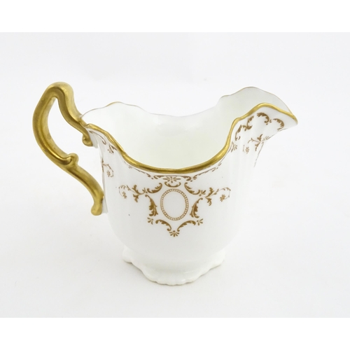 165 - A quantity of Royal Doulton tea wares with gilt decoration to include milk jug, sugar bowl, cups, sa... 