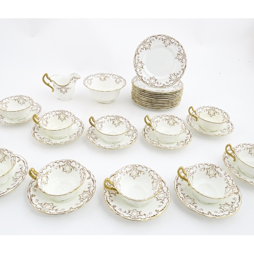 165 - A quantity of Royal Doulton tea wares with gilt decoration to include milk jug, sugar bowl, cups, sa... 