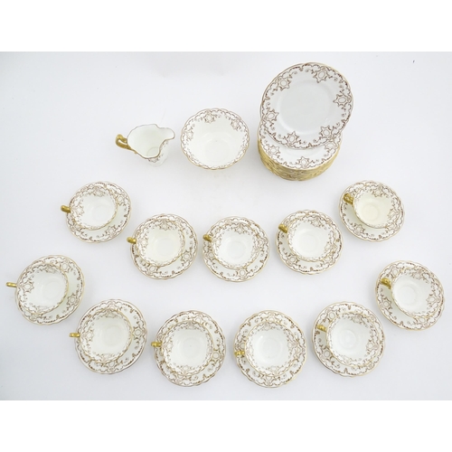 165 - A quantity of Royal Doulton tea wares with gilt decoration to include milk jug, sugar bowl, cups, sa... 