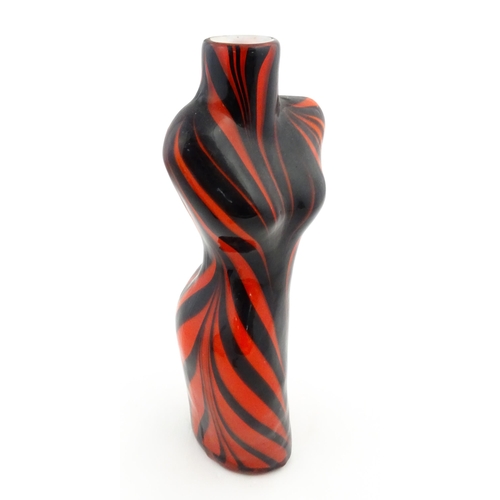 176 - A late 20thC glass vase modelled as a female torso with red and black detail. Approx 17 1/2