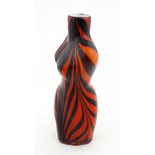 176 - A late 20thC glass vase modelled as a female torso with red and black detail. Approx 17 1/2