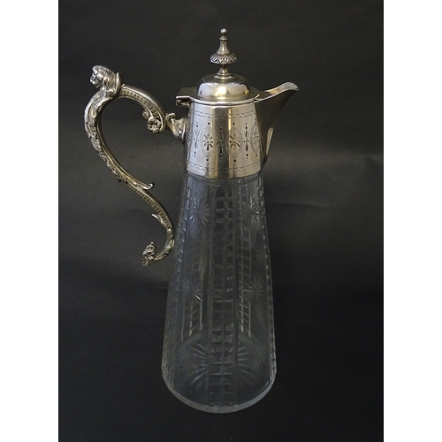 213 - A Mappin & Webb Princes plate claret jug, the cut glass body with silver plated mounts. Approx 12