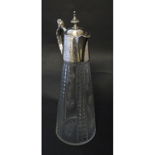 213 - A Mappin & Webb Princes plate claret jug, the cut glass body with silver plated mounts. Approx 12