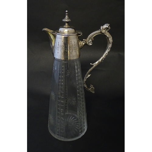 213 - A Mappin & Webb Princes plate claret jug, the cut glass body with silver plated mounts. Approx 12