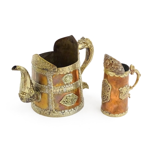 1046 - Two Tibetan copper vessels comprising a kettle / ewer with a shaped rim, stylised dragon handle and ... 