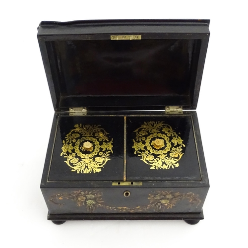 1067 - A Victorian lacquered papier mache tea caddy with abalone inlay and hand painted floral and gilt dec... 