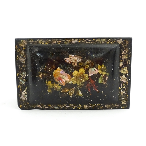 1067 - A Victorian lacquered papier mache tea caddy with abalone inlay and hand painted floral and gilt dec... 