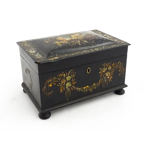 1067 - A Victorian lacquered papier mache tea caddy with abalone inlay and hand painted floral and gilt dec... 