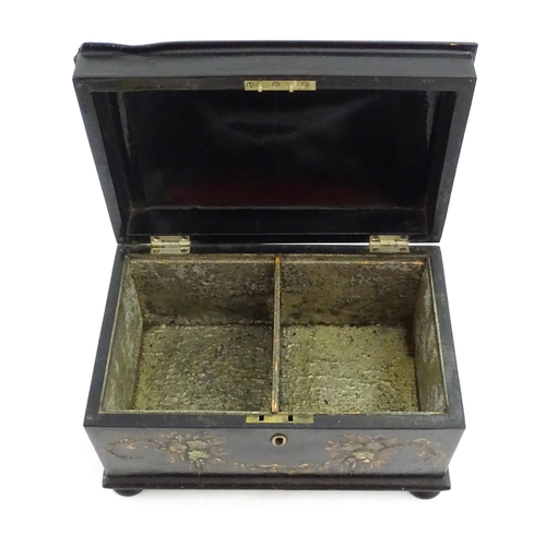 1067 - A Victorian lacquered papier mache tea caddy with abalone inlay and hand painted floral and gilt dec... 