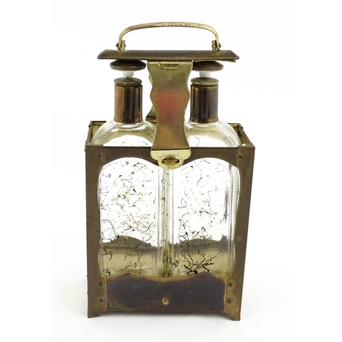 1084 - A 20thC musical decanter stand / carrier, containing two glass decanters. Approx. 11 1/2