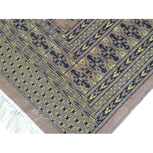 1314 - Carpet / Rug : A grey ground rug decorated with central medallions and banded geometric borders. App... 