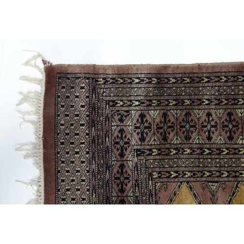 1314 - Carpet / Rug : A grey ground rug decorated with central medallions and banded geometric borders. App... 