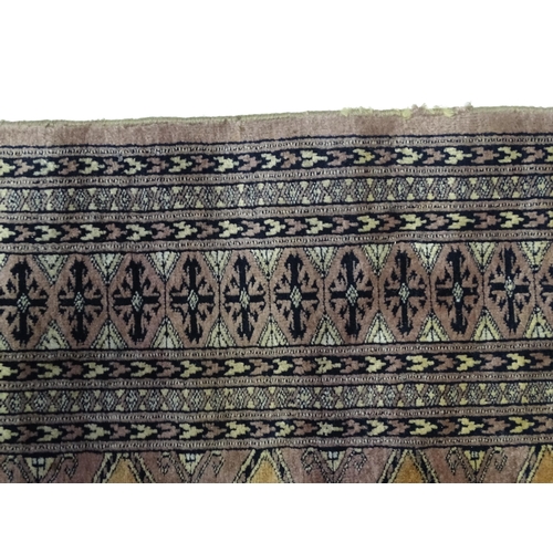 1314 - Carpet / Rug : A grey ground rug decorated with central medallions and banded geometric borders. App... 