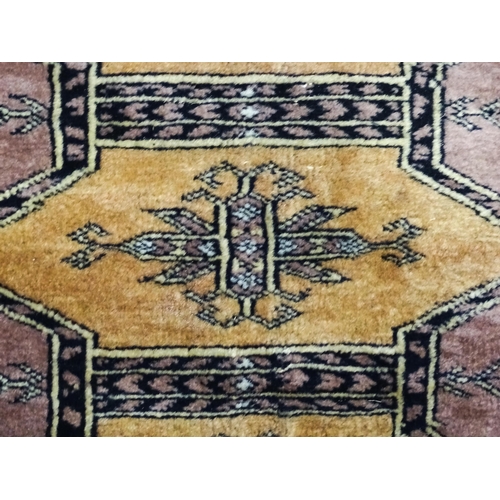 1314 - Carpet / Rug : A grey ground rug decorated with central medallions and banded geometric borders. App... 