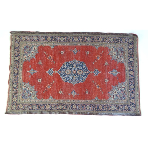 1312 - Carpet / Rug : A Central Persian Kashan rug, the red ground with central blue ground vignette, decor... 