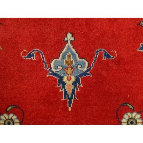 1312 - Carpet / Rug : A Central Persian Kashan rug, the red ground with central blue ground vignette, decor... 