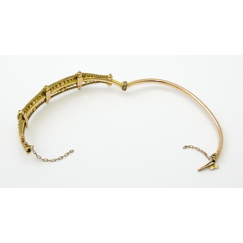 591 - A Victorian 9ct gold bracelet of bangle form set with seed pearls (Approx. 7.5g)