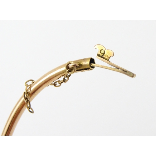 591 - A Victorian 9ct gold bracelet of bangle form set with seed pearls (Approx. 7.5g)