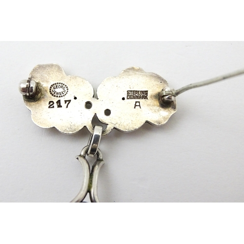 598 - Scandinavian Silver : A Danish Georg Jensen pair of earrings, marked Georg Jensen Sterling Denmark a... 