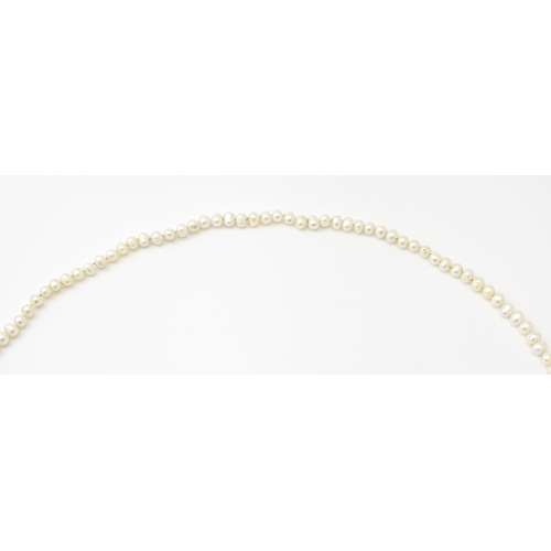 718 - A freshwater pearl necklace. Approx. 48