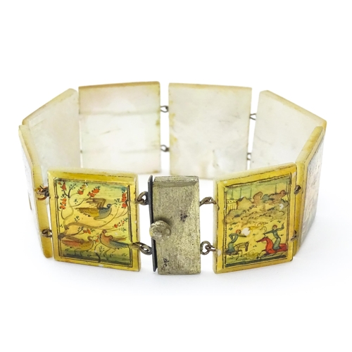 734 - An Indian bracelet with mother of pearl panels decorated  with scenes depicting figures, birds etc.