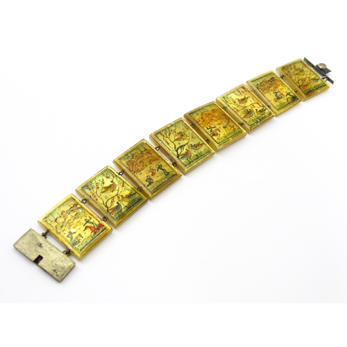 734 - An Indian bracelet with mother of pearl panels decorated  with scenes depicting figures, birds etc.