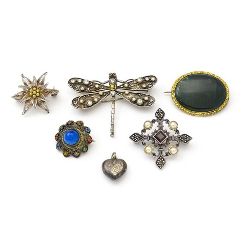 737 - Five assorted brooches to include some two silver examples, and a heart shaped silver locket. (6)