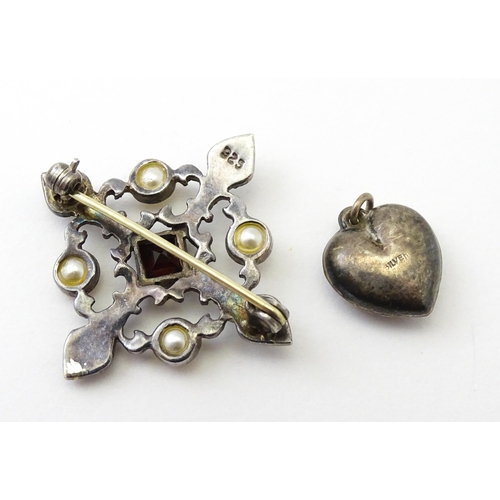 737 - Five assorted brooches to include some two silver examples, and a heart shaped silver locket. (6)