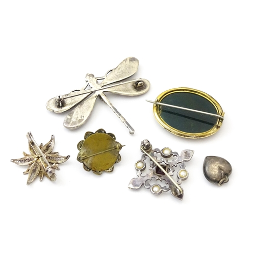 737 - Five assorted brooches to include some two silver examples, and a heart shaped silver locket. (6)