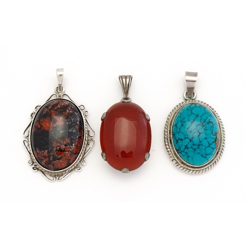 738 - Three various pendants to include agate, and turquoise examples. Largest approx. 1 1/4