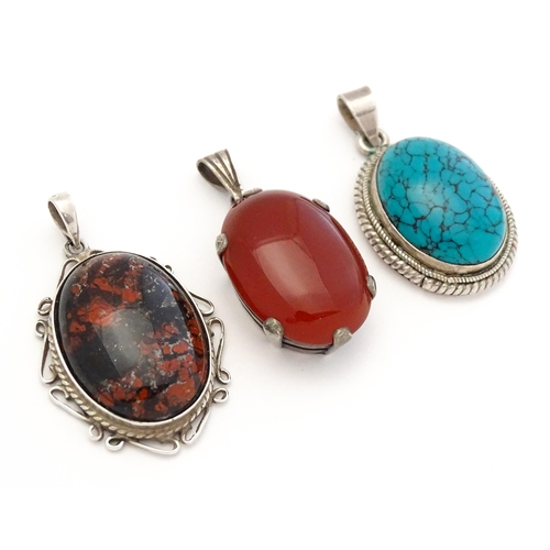 738 - Three various pendants to include agate, and turquoise examples. Largest approx. 1 1/4