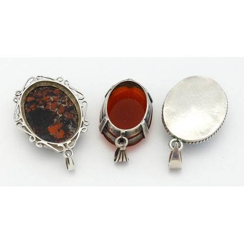 738 - Three various pendants to include agate, and turquoise examples. Largest approx. 1 1/4