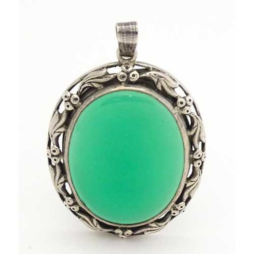 746 - A silver pendant set with green cabochon. Approx. 1 3/4