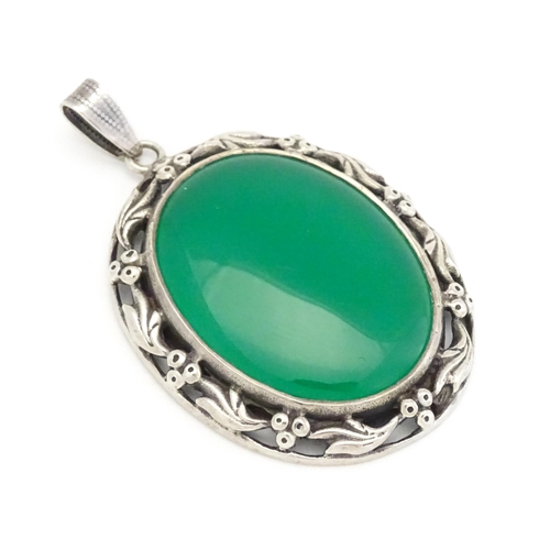 746 - A silver pendant set with green cabochon. Approx. 1 3/4