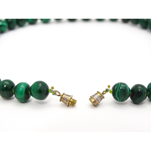 747 - A malachite graduated bead necklace. Approx 18