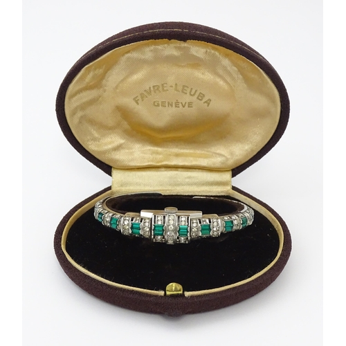 808 - A Swiss bangle formed cocktail watch set with white and green stones, the central section  hinging o... 