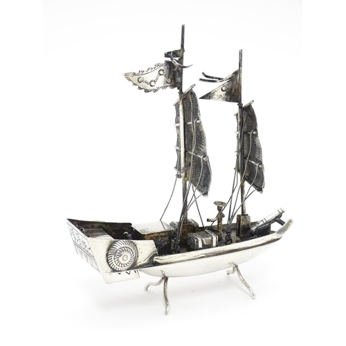 265 - An Oriental silver model of a boat. Marked sterling with Oriental character marks and stamped HKPP. ... 