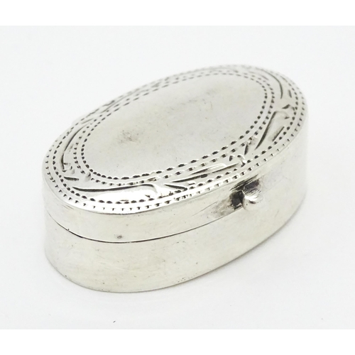 270 - A .925 silver pill box of oval form with engraved decoration and hinged lid. Approx 1 1/4