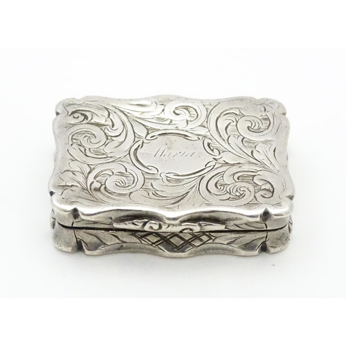 274 - A silver vinaigrette with acanthus scroll decoration. Hallmarked Birmingham 1845, maker Nathaniel Mi... 