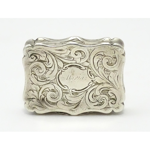 274 - A silver vinaigrette with acanthus scroll decoration. Hallmarked Birmingham 1845, maker Nathaniel Mi... 