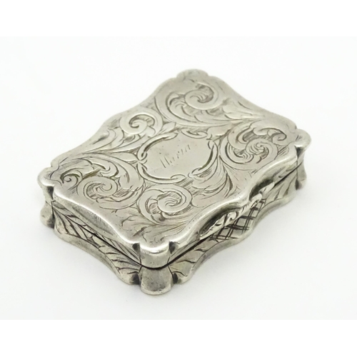 274 - A silver vinaigrette with acanthus scroll decoration. Hallmarked Birmingham 1845, maker Nathaniel Mi... 