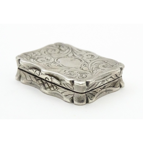 274 - A silver vinaigrette with acanthus scroll decoration. Hallmarked Birmingham 1845, maker Nathaniel Mi... 