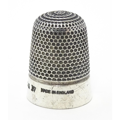 276 - A Victorian silver thimble hallmarked Birmingham 1898, maker Henry Griffiths & Sons Ltd. Together wi... 