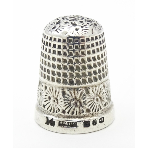 276 - A Victorian silver thimble hallmarked Birmingham 1898, maker Henry Griffiths & Sons Ltd. Together wi... 