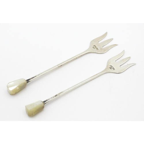 283 - Two silver cocktail / pickle forks with mother of pearl handles, hallmarked Sheffield 1935, maker Vi... 