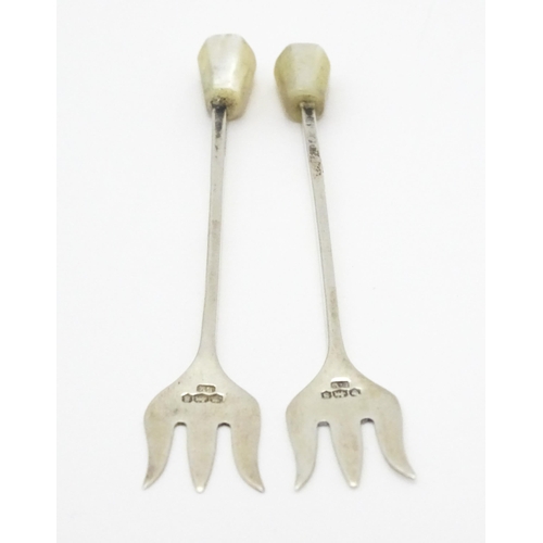 283 - Two silver cocktail / pickle forks with mother of pearl handles, hallmarked Sheffield 1935, maker Vi... 