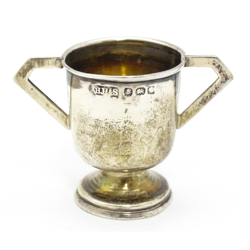 291 - A miniature silver twin handled trophy cup hallmarked Birmingham c. 1907, maker Henry Hobson & Sons.... 