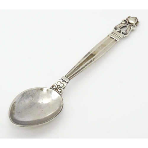 310 - A Georg Jensen silver teaspoon marked Sterling Denmark. Approx. 4 1/2